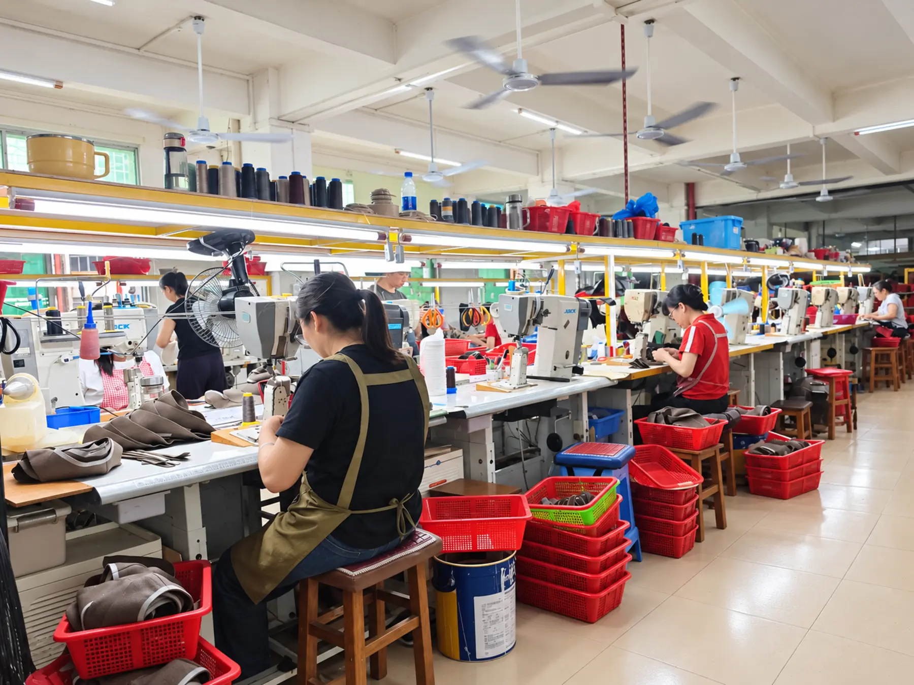 Qineng footwear makers working at production benches